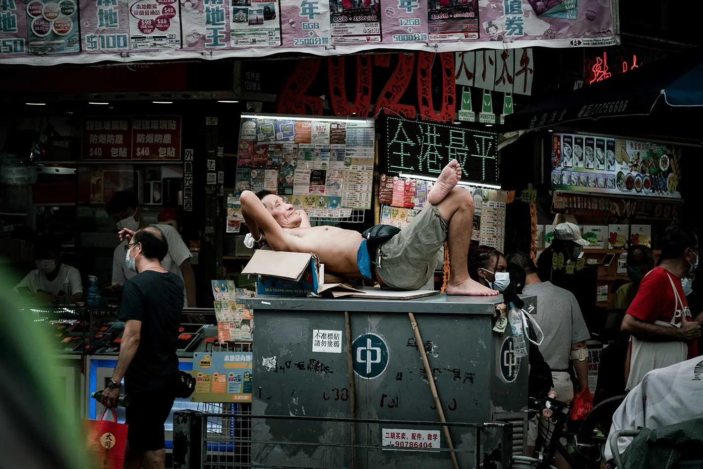Street scene, Hong Kong, October 2020 (Photo by <a href="https://unsplash.com/@drown_in_city?utm_content=creditCopyText&utm_medium=referral&utm_source=unsplash">drown_ in_city</a> on <a href="https://unsplash.com/photos/man-in-black-t-shirt-and-gray-pants-standing-on-the-street-cNKPOkmeWA4?utm_content=creditCopyText&utm_medium=referral&utm_source=unsplash">Unsplash</a>       