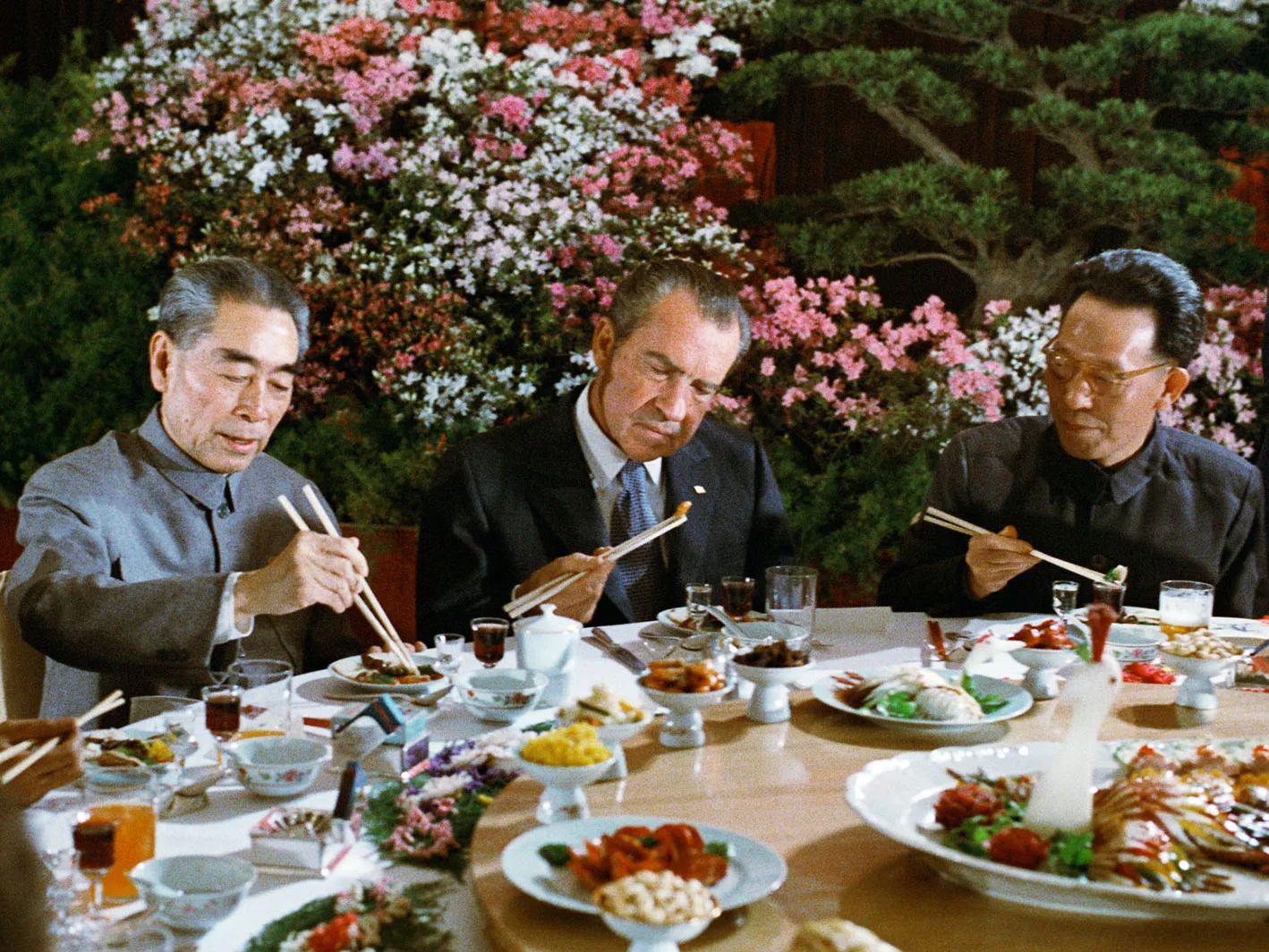 President Richard Nixon using chopsticks during a banquet with Premier Zhou Enlai of the People's Republic of China on Feb. 26, 1972