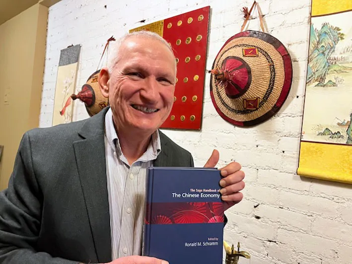Ronald M. Schramm with the new "Sage Handbook of the Chinese Economy" (2026)