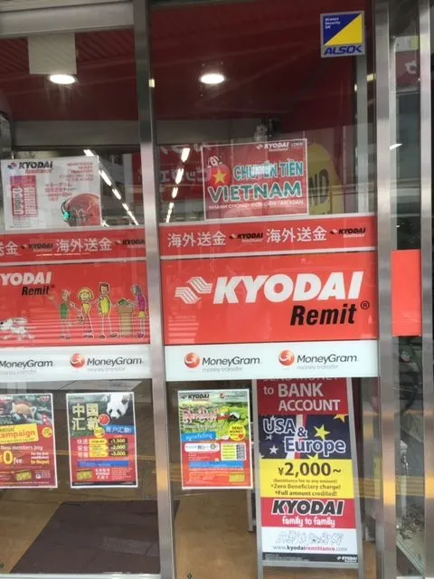A storefront in Tokyo’s Shin-Okubo neighborhood advertising remittance services for foreign residents of Japan